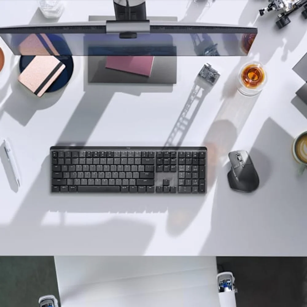A Logitech MX Master 3S in a desktop workspace, official Logitech photography